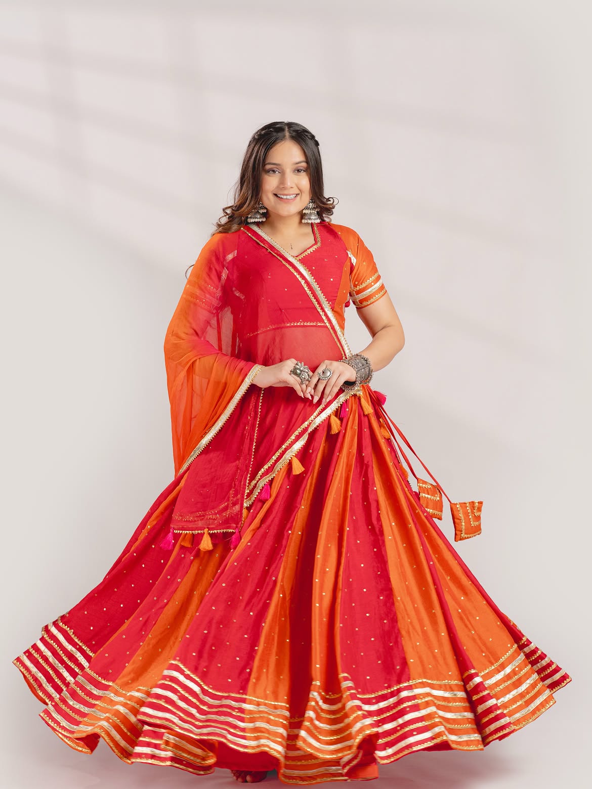 Vibrant Red & Orange Panel Chaniya Choli with Gota Patti & Tassel Details