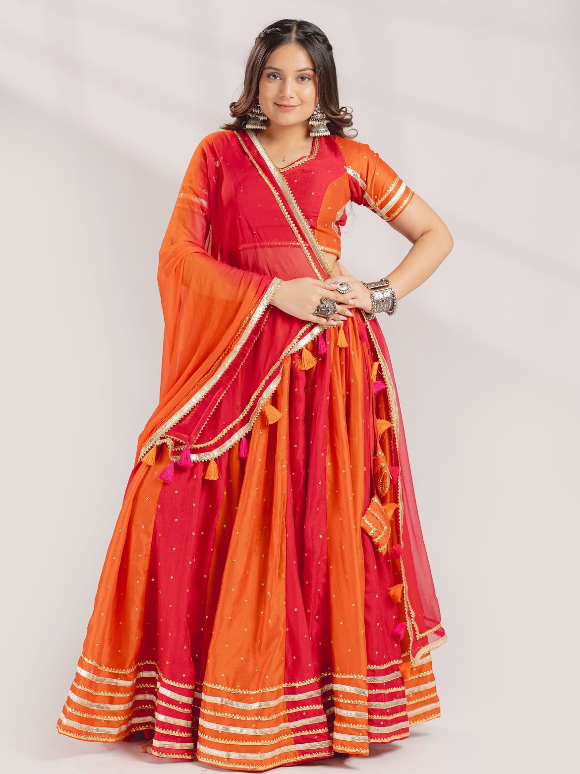 Vibrant Red & Orange Panel Chaniya Choli with Gota Patti & Tassel Details